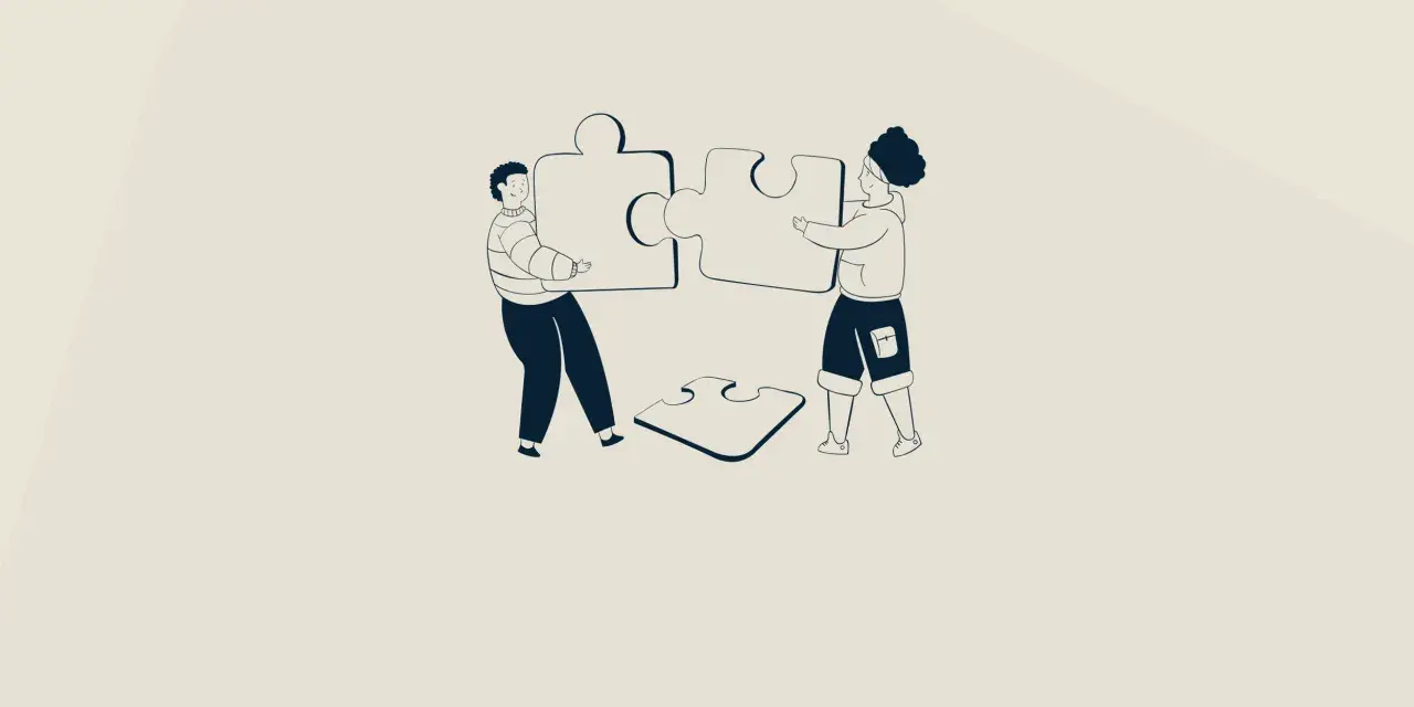 Twee personen leggen puzzelstukken bij elkaar, symbool voor gedeeld leiderschap in het onderwijs.